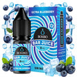 e-liquid bottle Bombo Bar Juice Ultra Blueberry Ice of 10 ml with a label in blue tones, next to its box, accompanied by blueberries and ice that evoke a sweet and refreshing flavor.